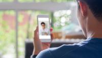 Male patient talks with doctor during a telehealth visit.
